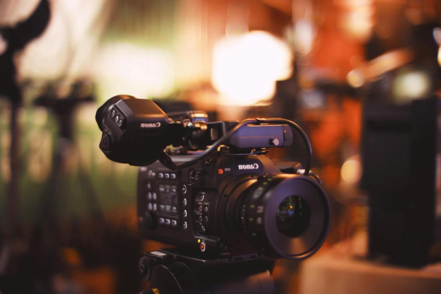 Instructor reviewing video editing timeline with student during live session