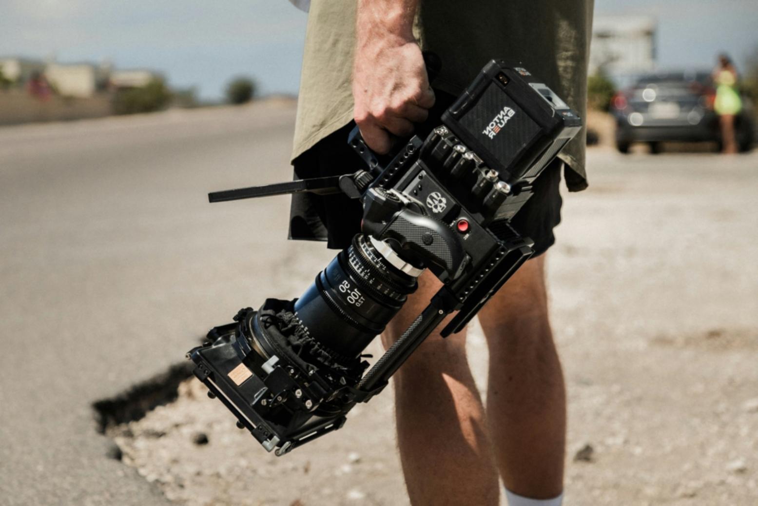 Professional video editing workspace with equipment and editing software